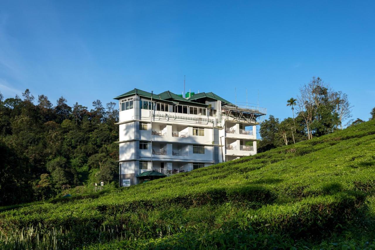 Monsoon Grande Hotel Мунар Екстериор снимка