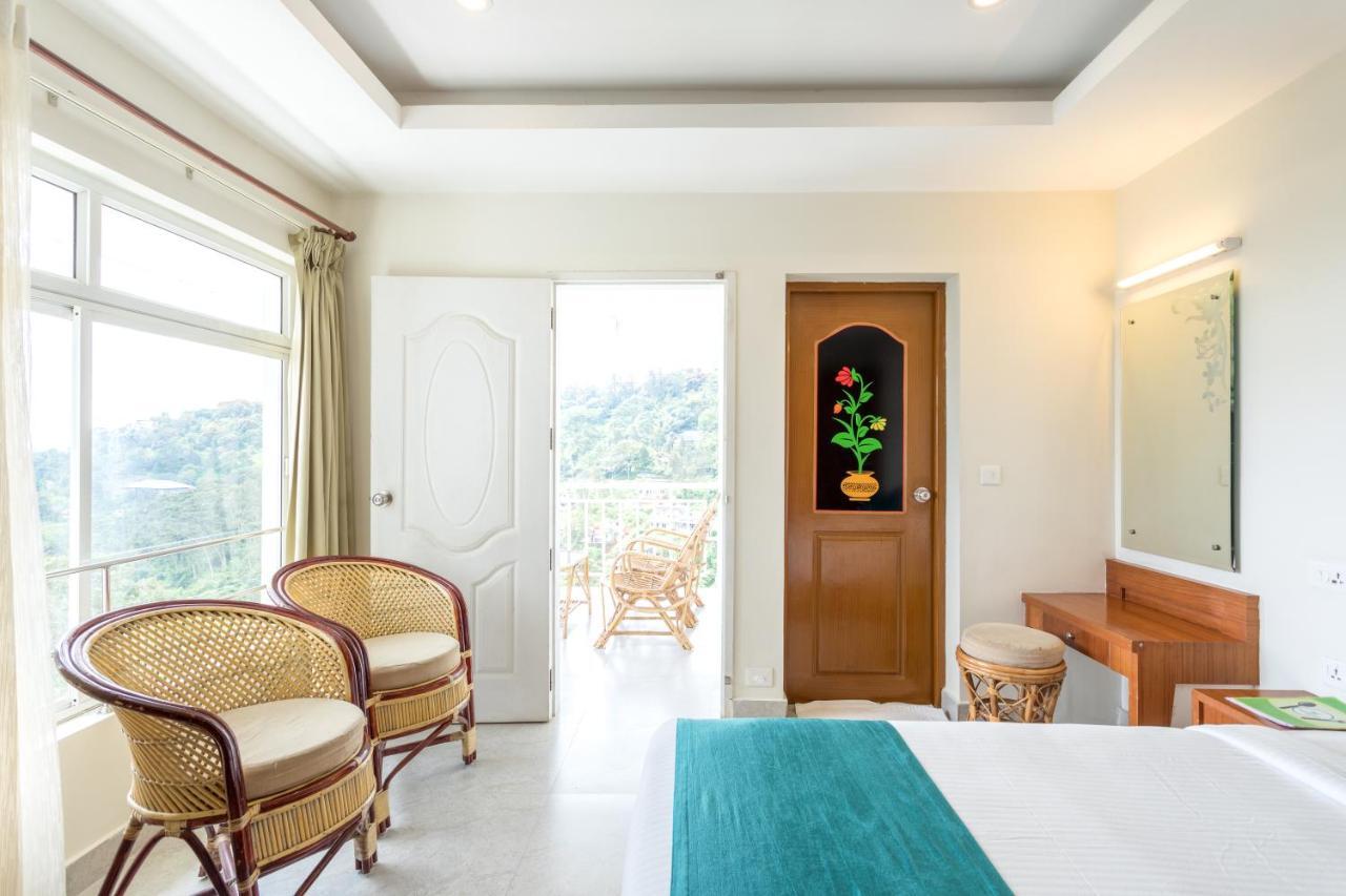 Monsoon Grande Hotel Мунар Екстериор снимка